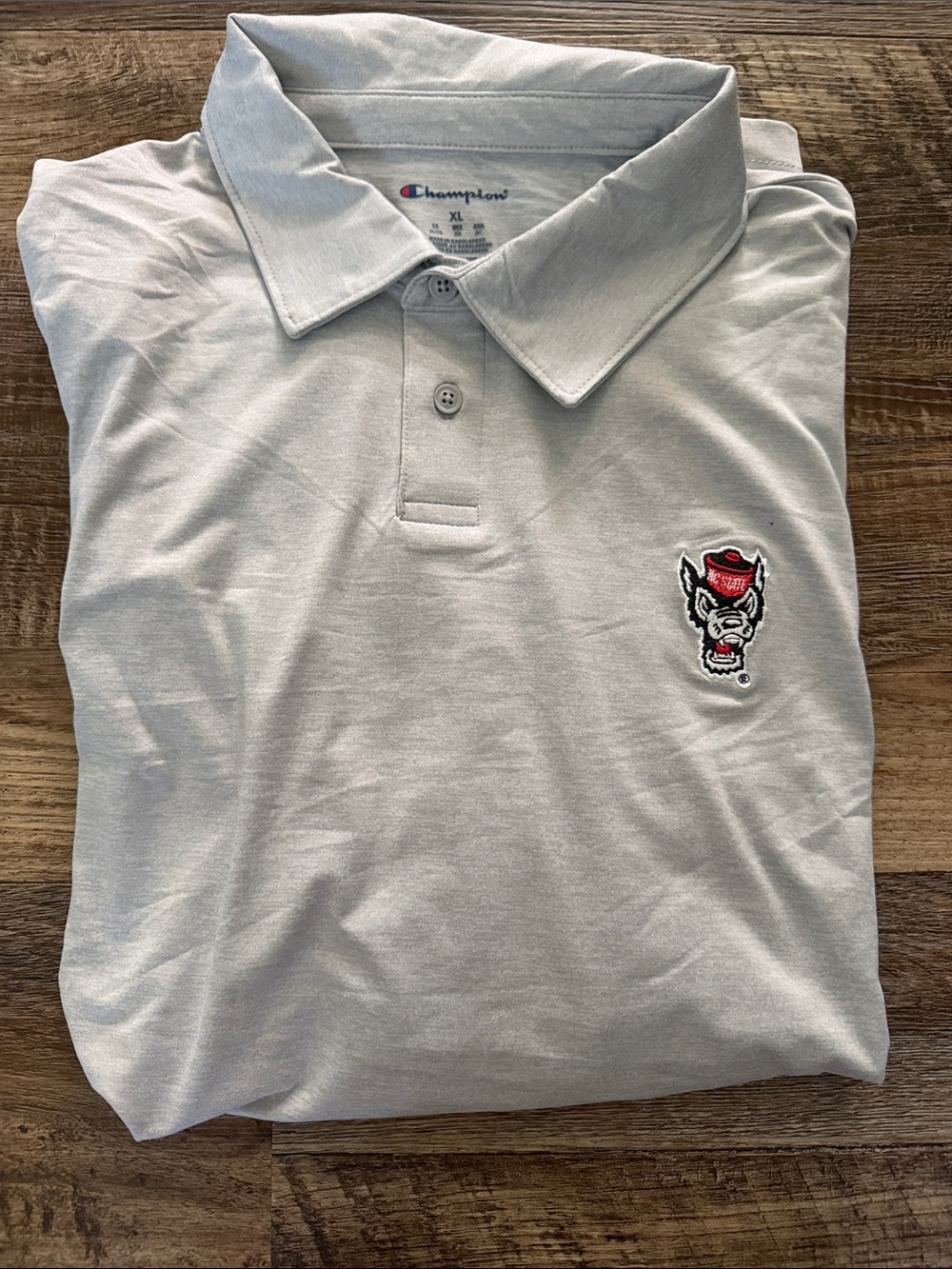 Champion Men’s Light Gray Polo with Embroidered NCSU Wolfpack Patch